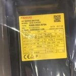 One New Fanuc Servo Motor A06B-0063-B704. Price: $1415.03.
